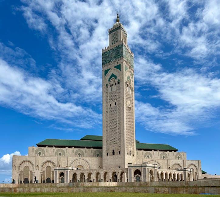 6-day trip from Marrakech, Majestic view of the Hassan II Mosque under a clear blue sky in Casablanca.