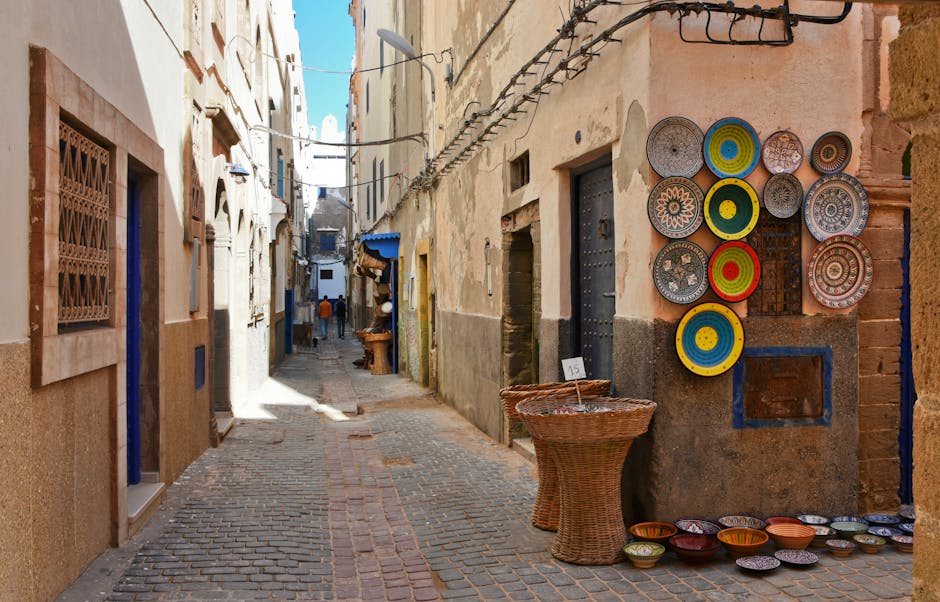 Colorful pottery adorns an alleyway in historic Essaouira, offering a glimpse into Moroccan culture.