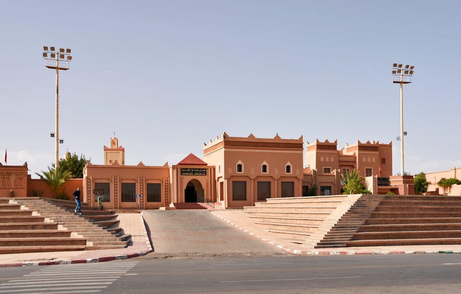 4 Days Desert tour from Ouarzazate, Historic Moroccan buildings with clear sky in Ouarzazate, showcasing traditional design elements.
