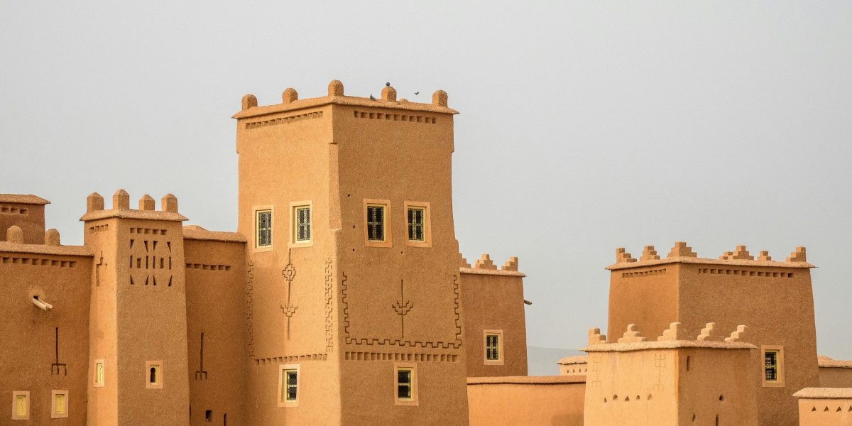 Traditional earthen architecture with towers, showcasing historical fortifications.